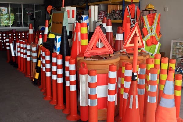 Orange traffic cones, reflective barriers and warning triangles